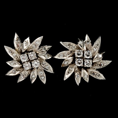 Lot 161 - A pair of diamond floral cluster earrings.