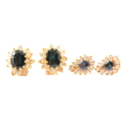 Lot 164 - Two pairs of sapphire and diamond cluster earrings.