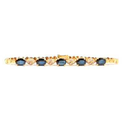 Lot 207 - A sapphire and diamond bracelet.