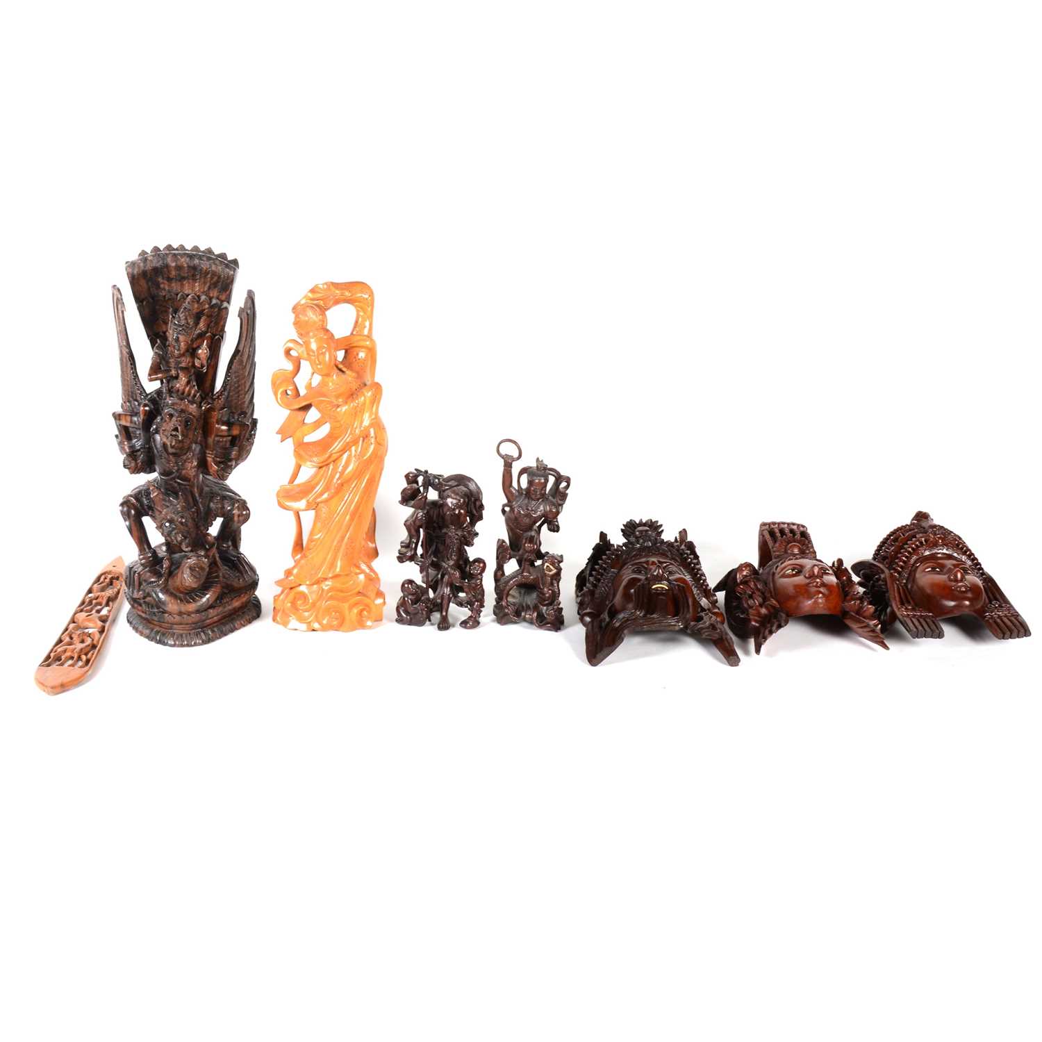 Lot 118 - Three Asian carved wooden wall masks, a large Balinese group carving, and others