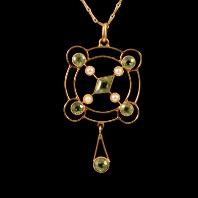 Lot 237 - An Edwardian peridot pendant and chain.