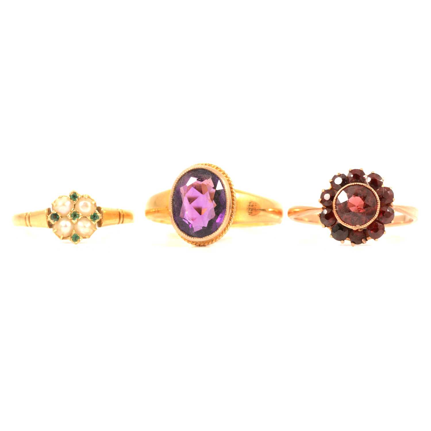 Lot 103 - Three gemset rings, amethyst, garnet and pearl.