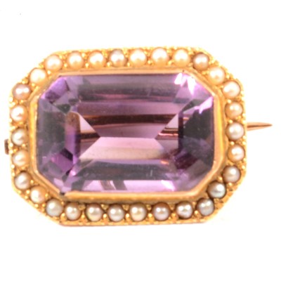 Lot 311 - An amethyst and seed pearl brooch.