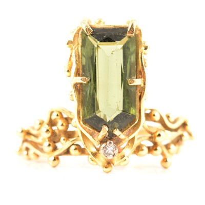 Lot 238 - A handmade design 18 carat gold ring set with green tourmaline.