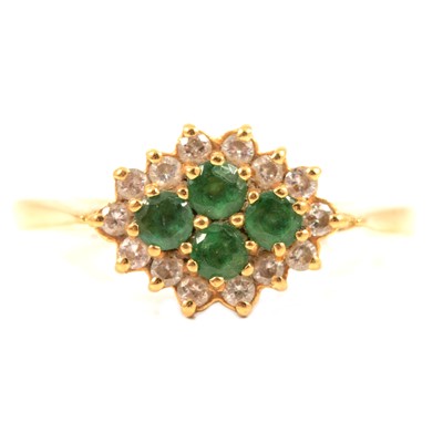 Lot 317A - An emerald and diamond cluster ring.