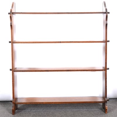 Lot 574 - Edwardian stained walnut four-heights bookcase