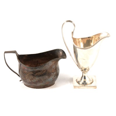 Lot 182 - Two George III silver cream jugs, maker's marks rubbed, London 1798 and 1811