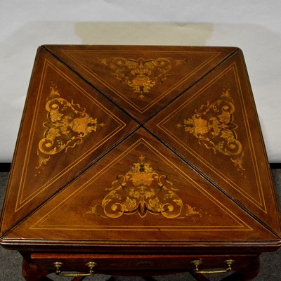 Lot 410 - Edwardian mahogany and marquetry envelope games table