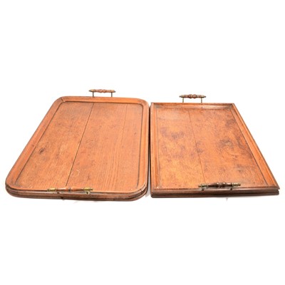 Lot 123 - Two oak serving trays, both with turned handles