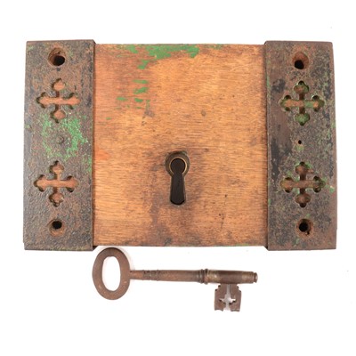 Lot 118 - Antique iron door lock with original key, on wooden block