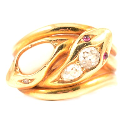 Lot 126 - A diamond and opal double snake head ring in 18 carat gold.