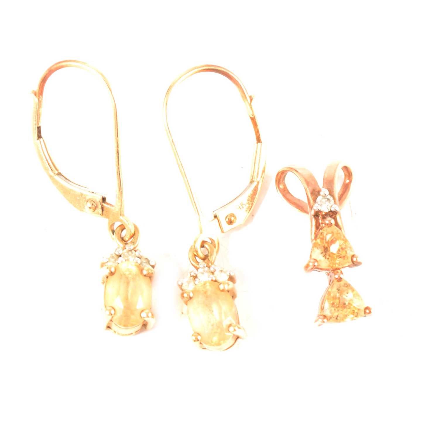 Lot 238 - Gemporia - an Imperial topaz and diamond pendant and similar earrings.