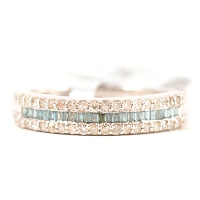 Lot 230 - Gemporia - a blue and white diamond half eternity ring.