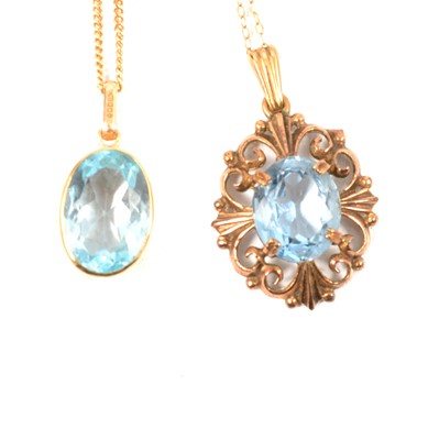 Lot 378 - A heat treated blue topaz pendant and a spinel pendant.