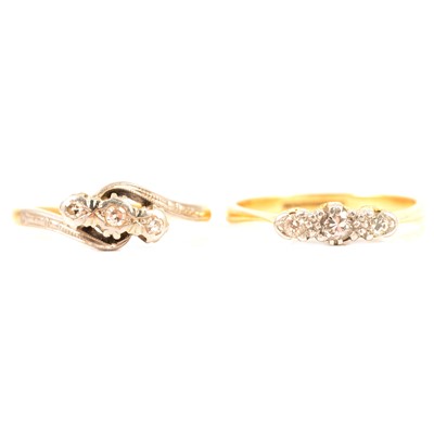 Lot 224 - Two diamond three stone rings.