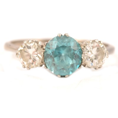 Lot 82 - A heat treated blue zircon and diamond three stone ring.