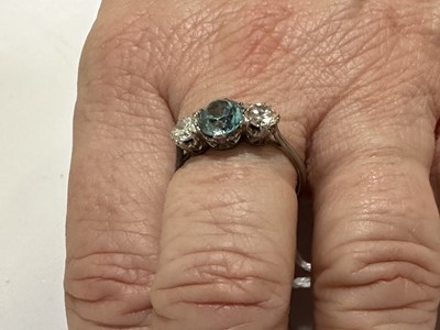 Lot 82 - A heat treated blue zircon and diamond three stone ring.