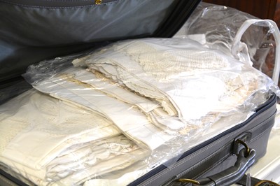 Lot 184 - A suitcase of vintage linen.