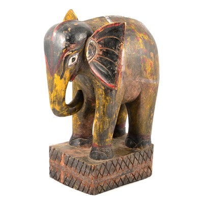 Lot 145 - Carved wooden elephant.