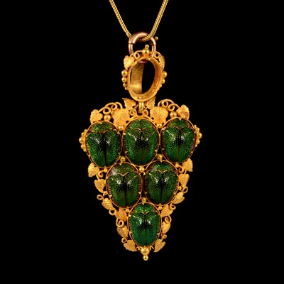 Lot 229 - A yellow metal scarab style pendant on a foxtail link chain.
