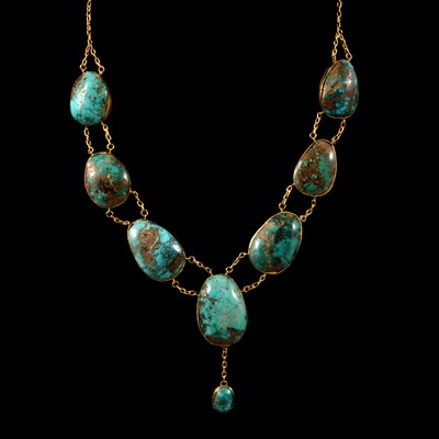 Lot 227 - A yellow metal necklace set with eight turquoise matrix.