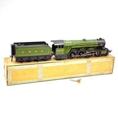 Lot 33 - Bassett-Lowke O gauge model railway clock-work locomotive with tender, 'Flying Scotsman' boxed