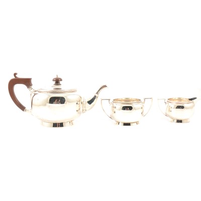 Lot 151 - A matched silver three piece teaset, William Neale & Son, Birmingham 1928-1949