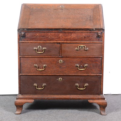 Lot 556 - George III oak bureau