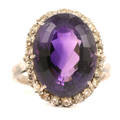Lot 99 - An amethyst and diamond cluster ring.