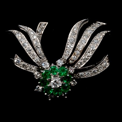 Lot 261 - An emerald and diamond brooch.