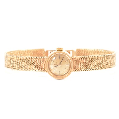 Lot 379 - Omega - a lady's 9 carat yellow gold bracelet watch.