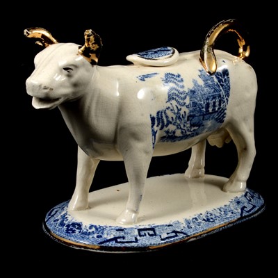 Lot 29 - Staffordshire Cow Creamer with Willow pattern transfer, 19th century