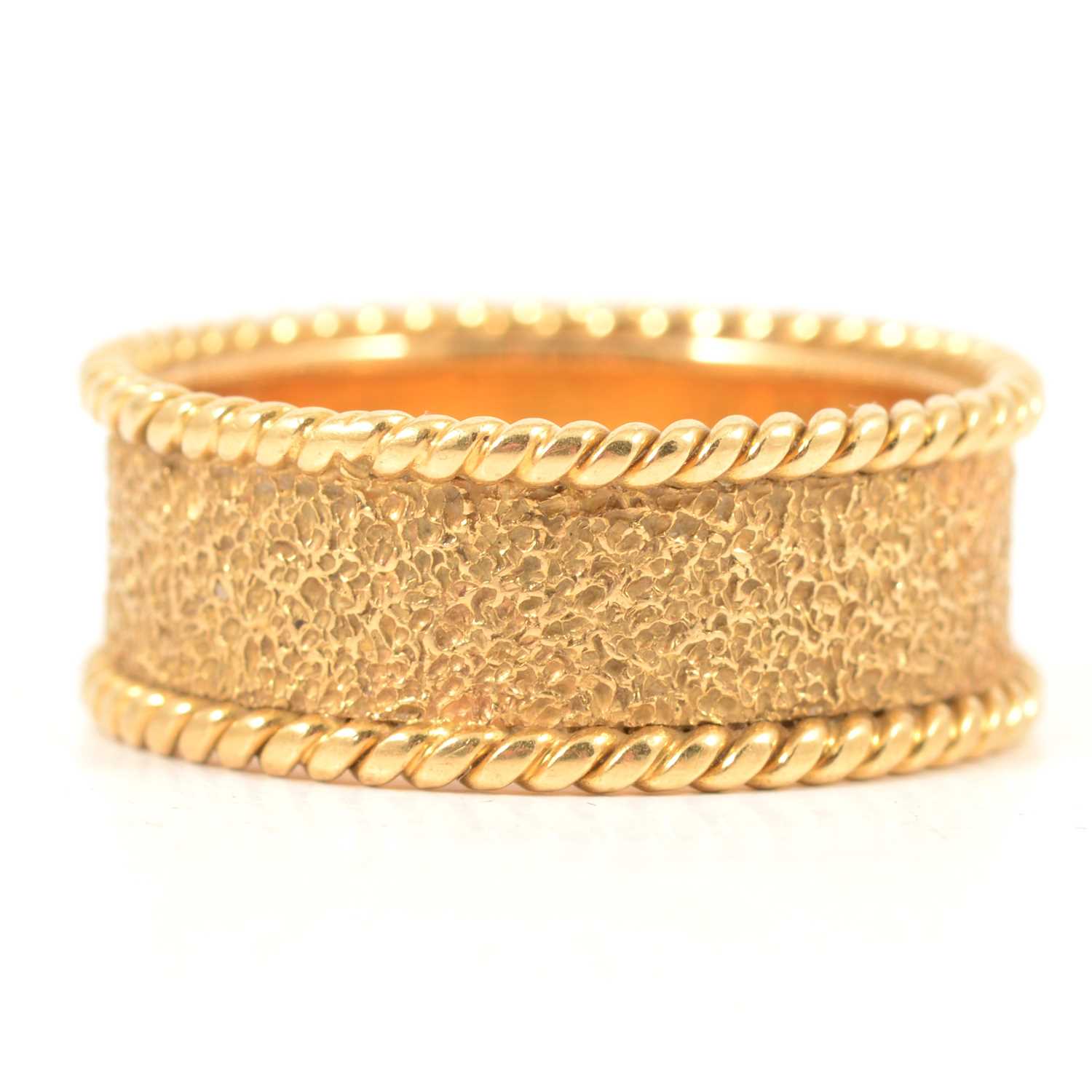 Lot 133 - P Pike & Partners - an 18 carat yellow gold band.