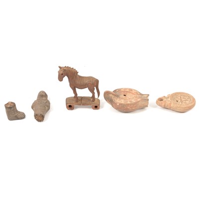 Lot 277 - Two Roman / Middle Eastern oil lamps, Egyptian shabti figure, and a small wooden horse.