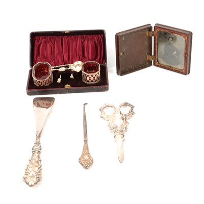 Lot 341 - A cased set of silver salts, bakelite book photograph frame, grape scissors, button hook and shoe horn..