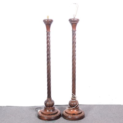 Lot 565 - Pair of carved oak standard lamps