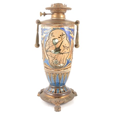 Lot 39 - Florence Barlow for Doulton Lambeth, a stoneware oil lamp base with ornate metal mounts