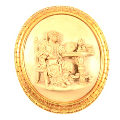 Lot 272 - A large lava cameo brooch in gold coloured mount.