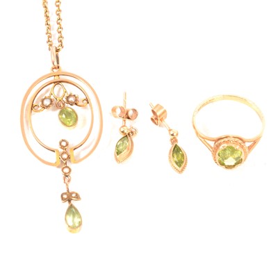 Lot 370 - An Edwardian peridot and seed pearl pendant, peridot earrings, and ring.