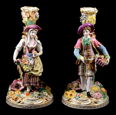 Lot 27 - A pair Minton porcelain figural candlesticks, depicting Fruit and Flower sellers