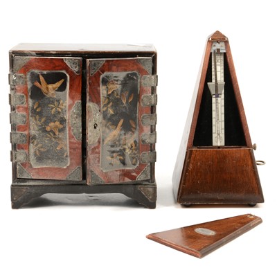 Lot 141 - Japanese lacquered table cabinet and a metronome