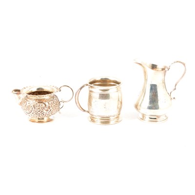 Lot 323 - A silver cream jug, Nathan & Hayes, Birmingham 1890, another other small silver items.