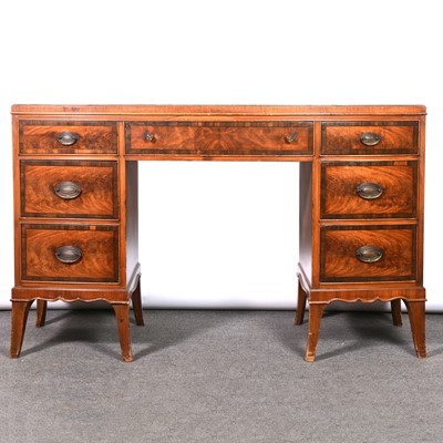 Lot 397 - Bowfront walnut and mahogany desk