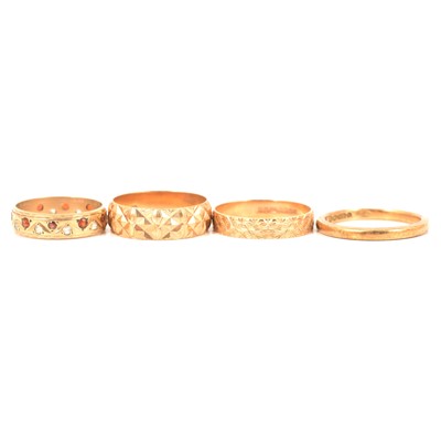 Lot 354 - Four wedding rings and an eternity ring.