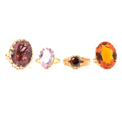 Lot 348 - Four 9 carat yellow gold stone set dress rings.