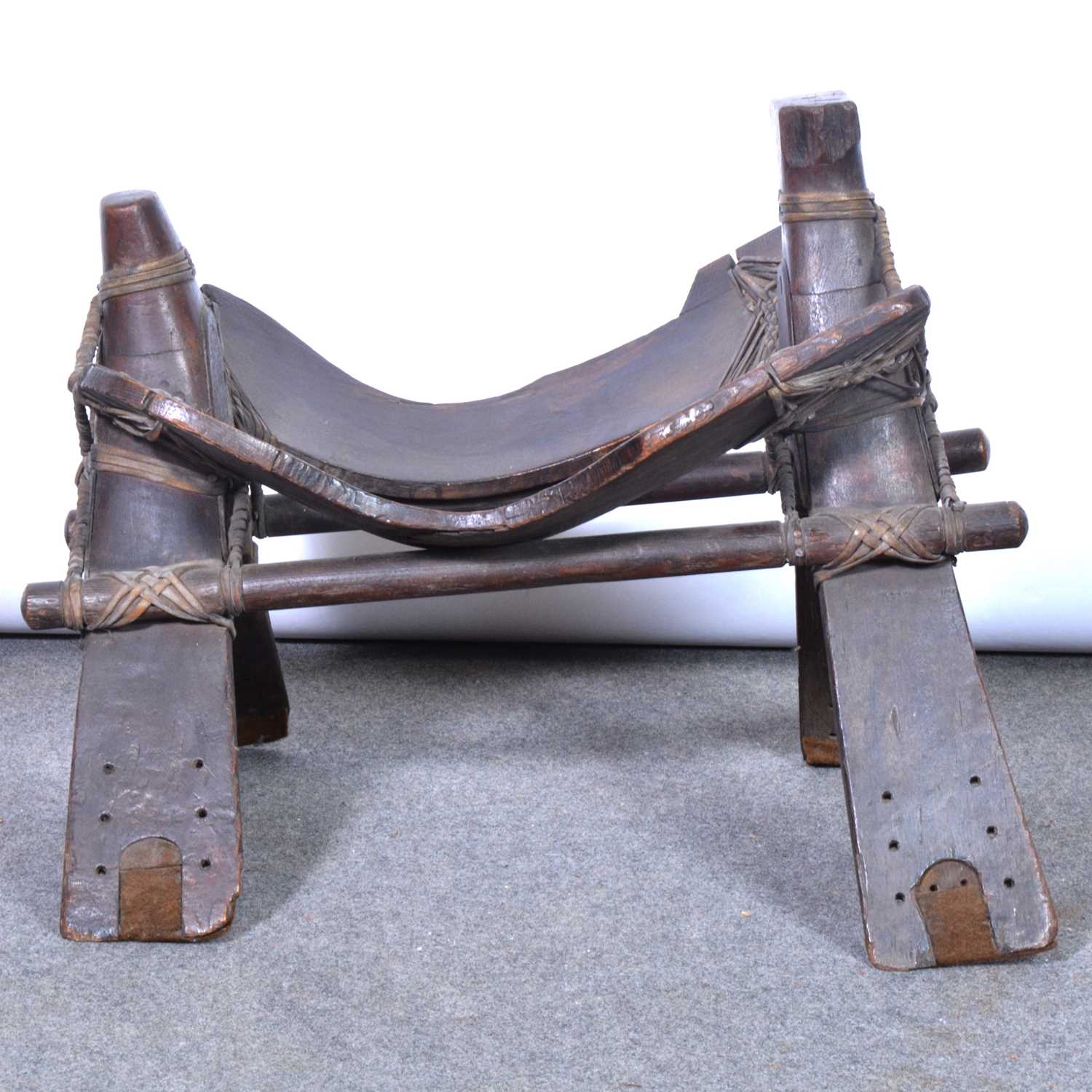 Lot 159 - Old rattan-bound wooden camel seat