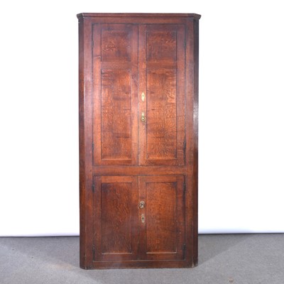 Lot 467 - George III oak freestanding corner cupboard