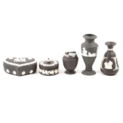 Lot 55 - Wedgwood black jasperware lidded trinket boxes, vases, pin dishes, lighters and dwarf candlesticks.