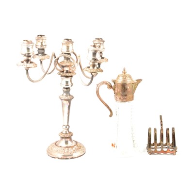 Lot 174 - Silver-plated claret jug, four bottle cruet, desk stand, candelabra.