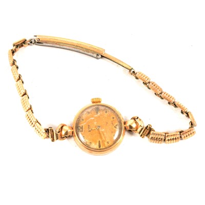 Lot 389 - Tissot - a lady's 9 carat gold watch with gold-plated bracelet.